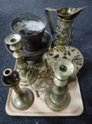 A tray of brass and copper including embossed jugs, trivet,