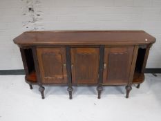 An antique mahogany low sideboard