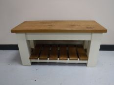 A reclaimed pine bench with under shelf,