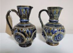 A pair of Royal Doulton Lambeth jugs,