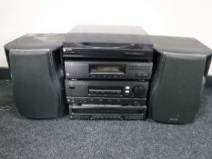 An Aiwa music centre with speakers