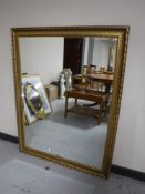 A gilt framed overmantel mirror