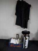 A box of assorted table linen and pictures together with a mid 20th century case containing lady's