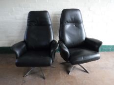 A pair of Hjort Knudsen leather adjustable armchairs