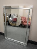 A glass framed mirror