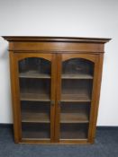 An Edwardian oak double door bookcase
