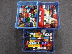 Three plastic trays containing assorted die cast vehicles