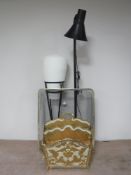 A metal spark guard together with a magazine rack,