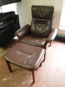 A late 20th century Danish rosewood framed brown leather armchair and stool