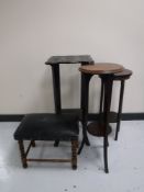 A carved ebonised plant stand,