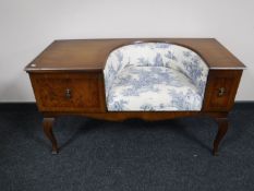 A walnut and mahogany telephone table