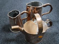 Two Victorian copper jugs and a copper watering can