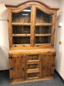A rustic pine kitchen cabinet,
