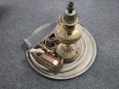 Two brass wall plaques, antique brass oil lamp base (converted), cased carving set,