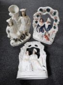 A pair of Staffordshire flat backed figures - Figures seated on a bench together with a