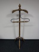 A contemporary pine and wrought iron gent's valet stand