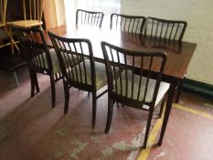 A mahogany extending table with two leaves,