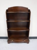A set of mahogany open shelves