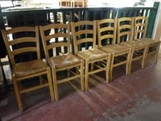 A set of six ladder back kitchen chairs
