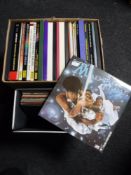 A box and a case containing LP's and LP box sets,