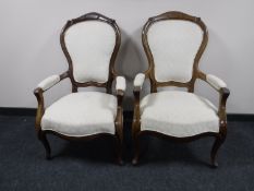 A pair of antique mahogany gentleman's armchairs
