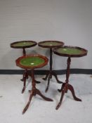 Four mahogany leather topped wine tables