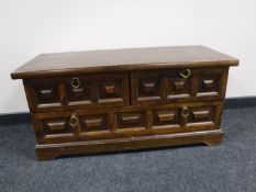 An audio stand fitted three drawers