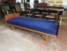 A teak 3' bed frame with mattress