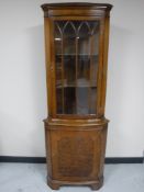 A mahogany corner display cabinet