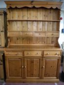 A pine triple door kitchen dresser
