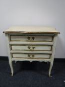 A 20th century painted three drawer chest