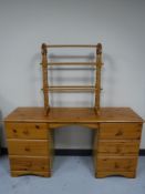 A pine six drawer dressing table and a pine towel rail