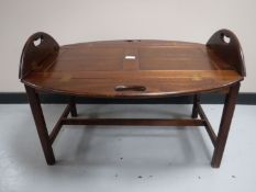 A mahogany butler's tray on stand