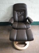 A Stressless brown leather adjustable armchair and stool