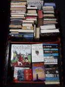 Two crates containing a quantity of hard back and paperback books, reference,