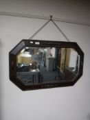 An Edwardian oak framed mirror,