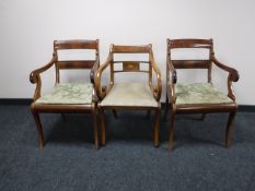 Three mahogany scroll arm armchairs