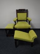 An Edwardian oak armchair and two upholstered footstools