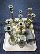 A tray of brass candlesticks and John Linwood antique spit