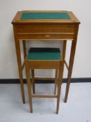 An early 20th century oak clerk's desk and stool