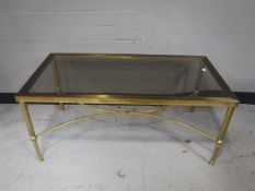 Two rectangular brass and glass topped coffee tables