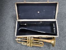 A cased Bass Bundy trumpet in case
