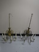 A pair of brass eight branch chandeliers