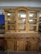 A rustic pine triple door dresser
