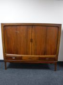 A Danish shutter door sideboard with three drawers beneath