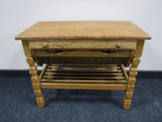 A blonde oak sewing table