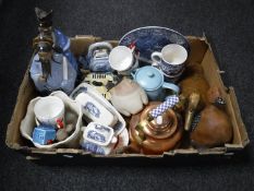 A box containing two wooden ducks, copper kettle, oriental figurines,