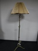A Victorian brass rise and fall standard lamp