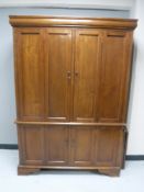 A hardwood double door linen cupboard CONDITION REPORT: 190cm by 132cm by 63cm.