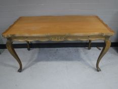 A shaped French walnut extending coffee table